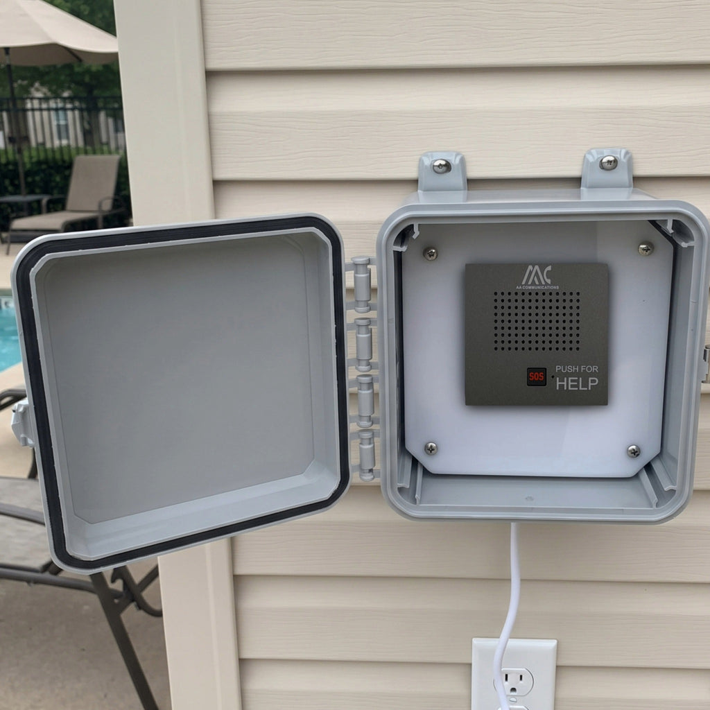 Outdoor emergency pool phone call box open and mounted on exterior siding near pool deck